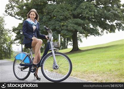 Young businessman riding bicycle while commuting to work