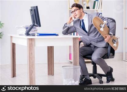 Young businessman riding skate in office during break