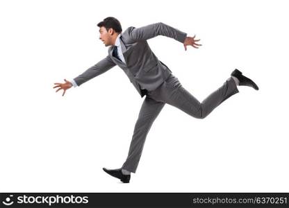 Young businessman running forward isolated on white
