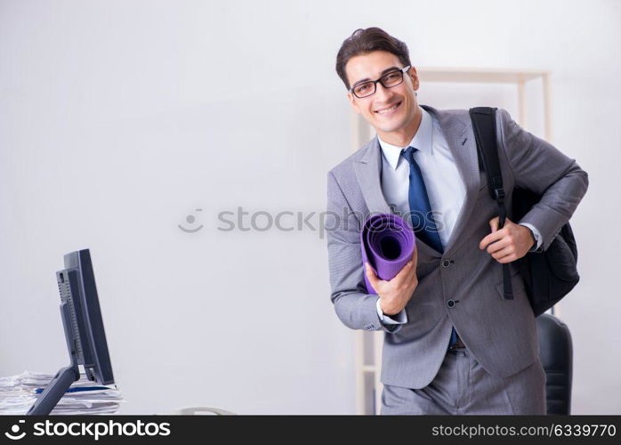 Young businessman rushing to sports gym during break