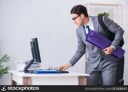 Young businessman rushing to sports gym during break