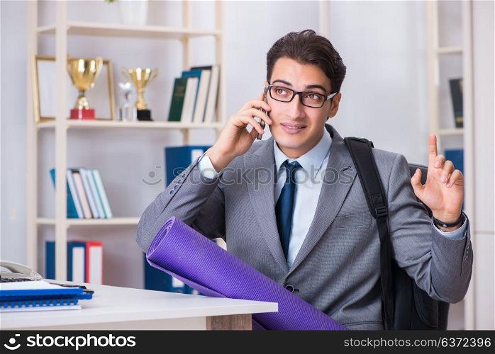 Young businessman rushing to sports gym during break