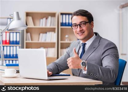 Young businessman sitting at the desk