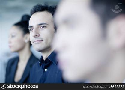 Young businessman sitting in a business meeting with colleagues