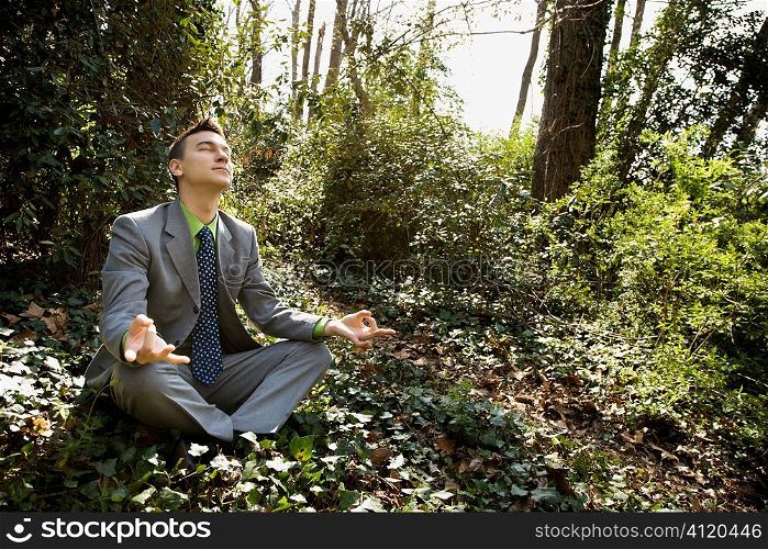 Young Businessman Sitting in Meditation