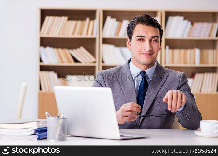 Young businessman sitting in office