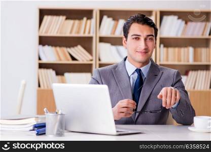 Young businessman sitting in office