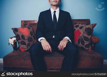 Young businessman sitting on a sofa