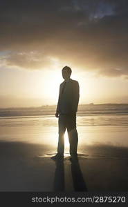 Young Businessman Standing on the Beach