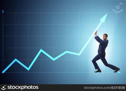 Young businessman supporting economic growth on business chart. The young businessman supporting economic growth on business chart
