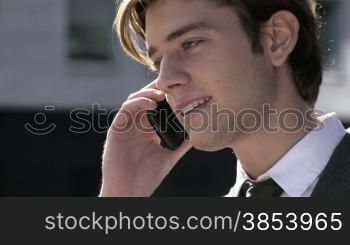 Young businessman talking on the telephone