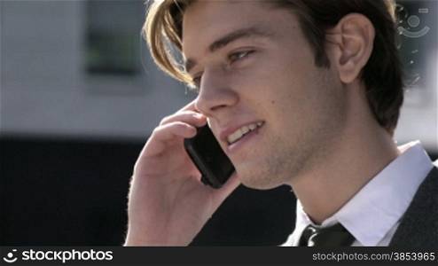 Young businessman talking on the telephone