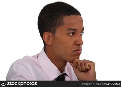 young businessman thinking and holding his chin