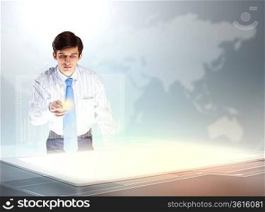 young businessman touching icon of high-tech image