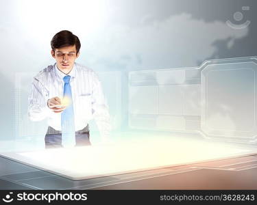 young businessman touching icon of high-tech image