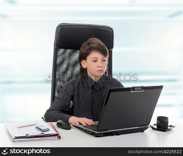 Young businessman using a laptop in the office.