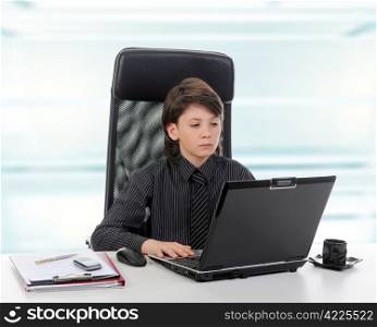 Young businessman using a laptop in the office.