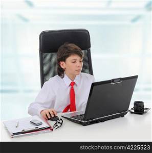 Young businessman using a laptop in the office. Isolated on white background