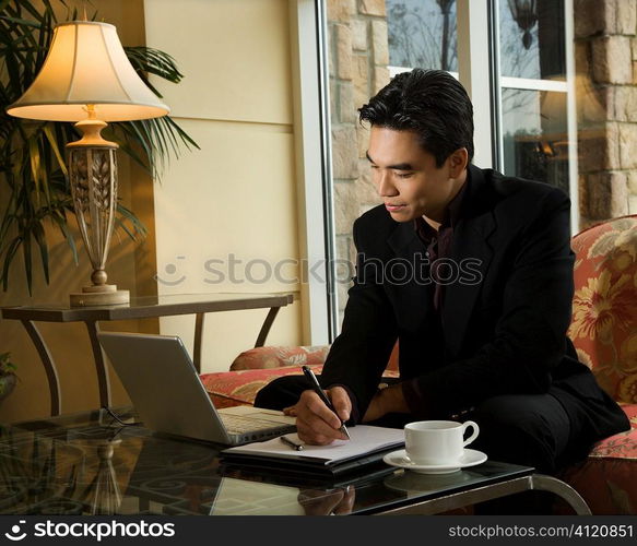 Young Businessman using Laptop