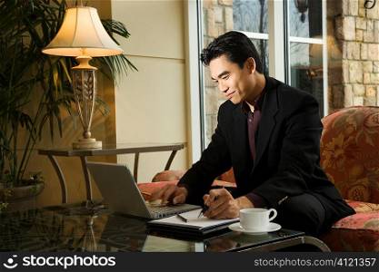 Young Businessman using Laptop