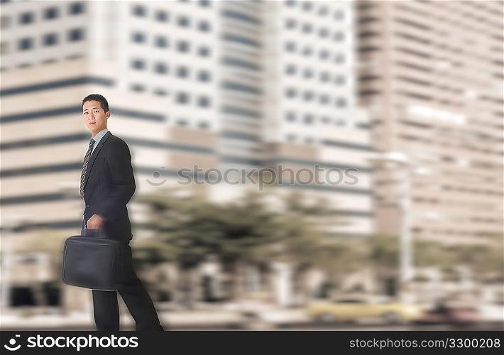 Young businessman walking