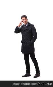 Young businessman wearing winter coat isolated on white