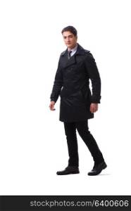 Young businessman wearing winter coat isolated on white