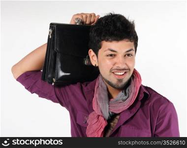 young businessman with a briefcase on the grey background