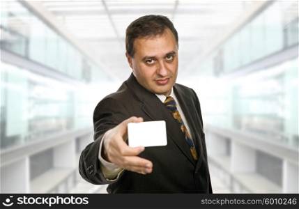 young businessman with a card, focus on the face