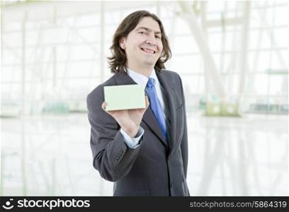 young businessman with a empty card at the office