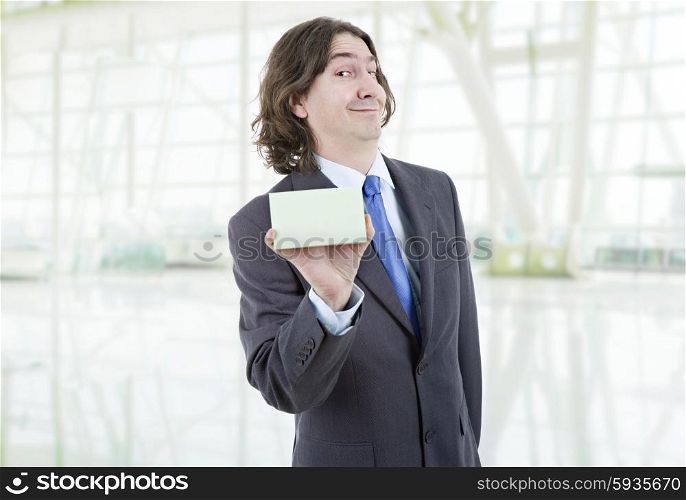 young businessman with a empty card, at the office