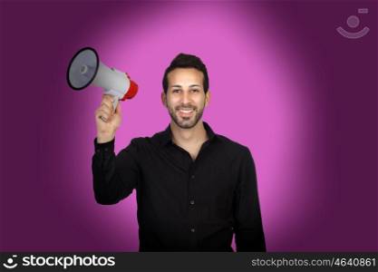 Young businessman with a Megaphone proclaiming something on purple background