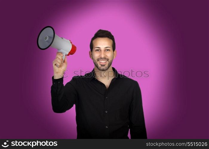 Young businessman with a Megaphone proclaiming something on purple background