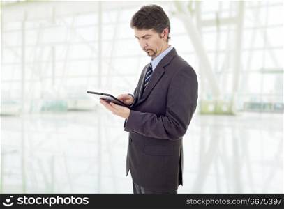 young businessman with a tablet pc, at the office. tablet pc