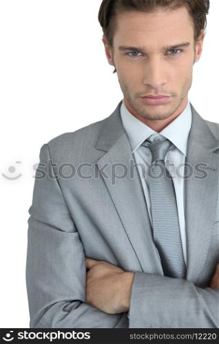 Young businessman with arms crossed