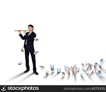 Young businessman with banknotes all around him