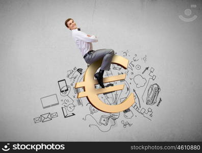 Young businessman with briefcase riding euro symbol. Making money is my specialty