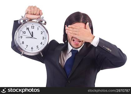 Young businessman with clock on white