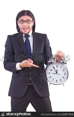 Young businessman with clock on white