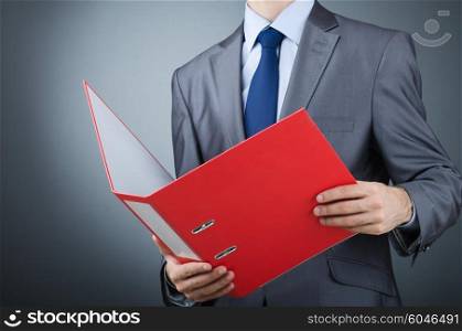 Young businessman with folders