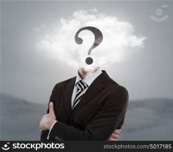 Young businessman with head in the clouds and question mark