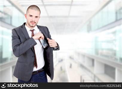 young businessman with money at the office