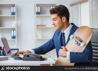 Young businessman with skate in office in sports concept