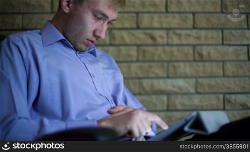 Young Businessman With Tablet Computer. RAW Video