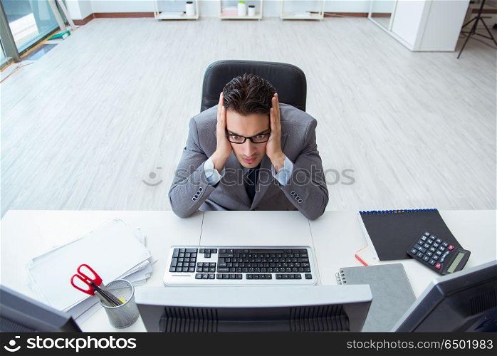 Young businessman working at his desk