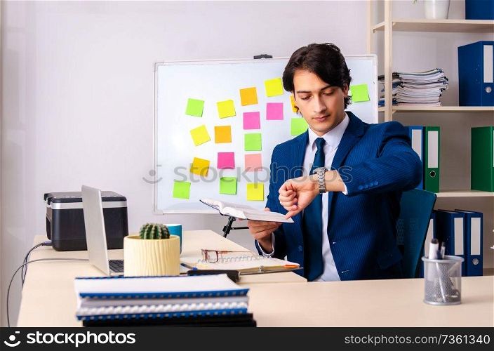 Young businessman working in the office 