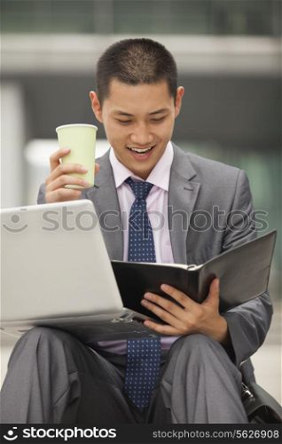 Young businessman working outdoor