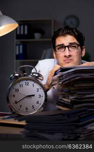 Young businessman working overtime late in office