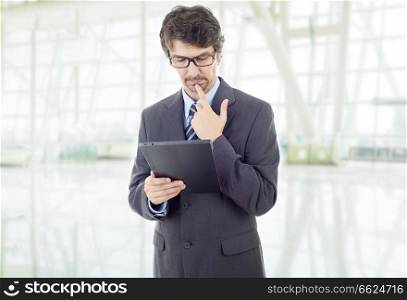 young businessman working with a tablet pc, at the office