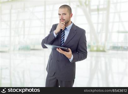 young businessman working with a tablet pc, at the office. tablet pc
